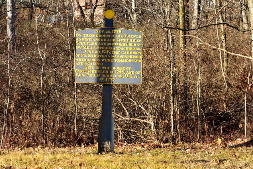 Historical marker next to the house of General Philip Schuyler at Schuylerville, NY, to commemorate the site where French and Indians killed Captain Philip Schuyler, and tomahawked and scalped dozens of men in 1745 and 1747
